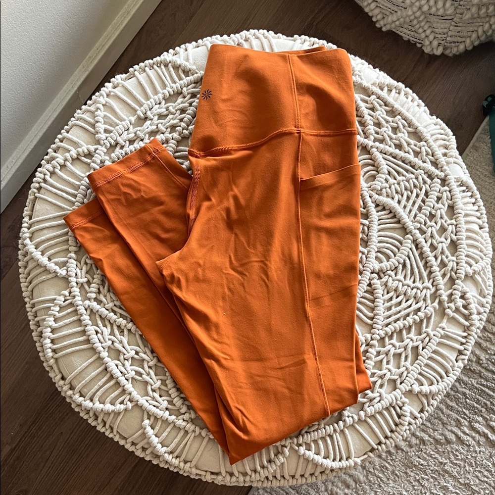 Athleta Salutation Stash Leggings in Foliage Orange